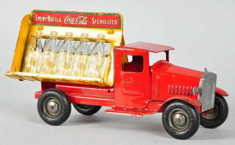 Appraisal: Pressed Steel Metalcraft Coca-Cola Truck Toy Description American Includes ten