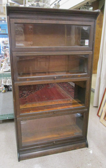 Appraisal: STACKING OAK BOOKCASE American c comprising four stacking horizontal bookcase