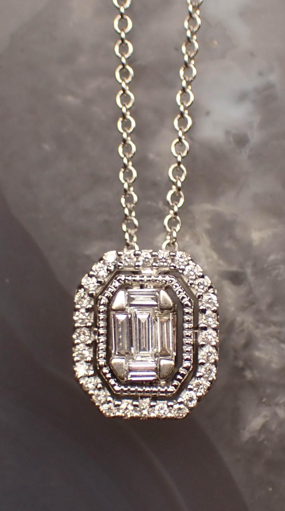 Appraisal: DIAMOND AND FOURTEEN KARAT GOLD PENDANT NECKLACE with a Italian