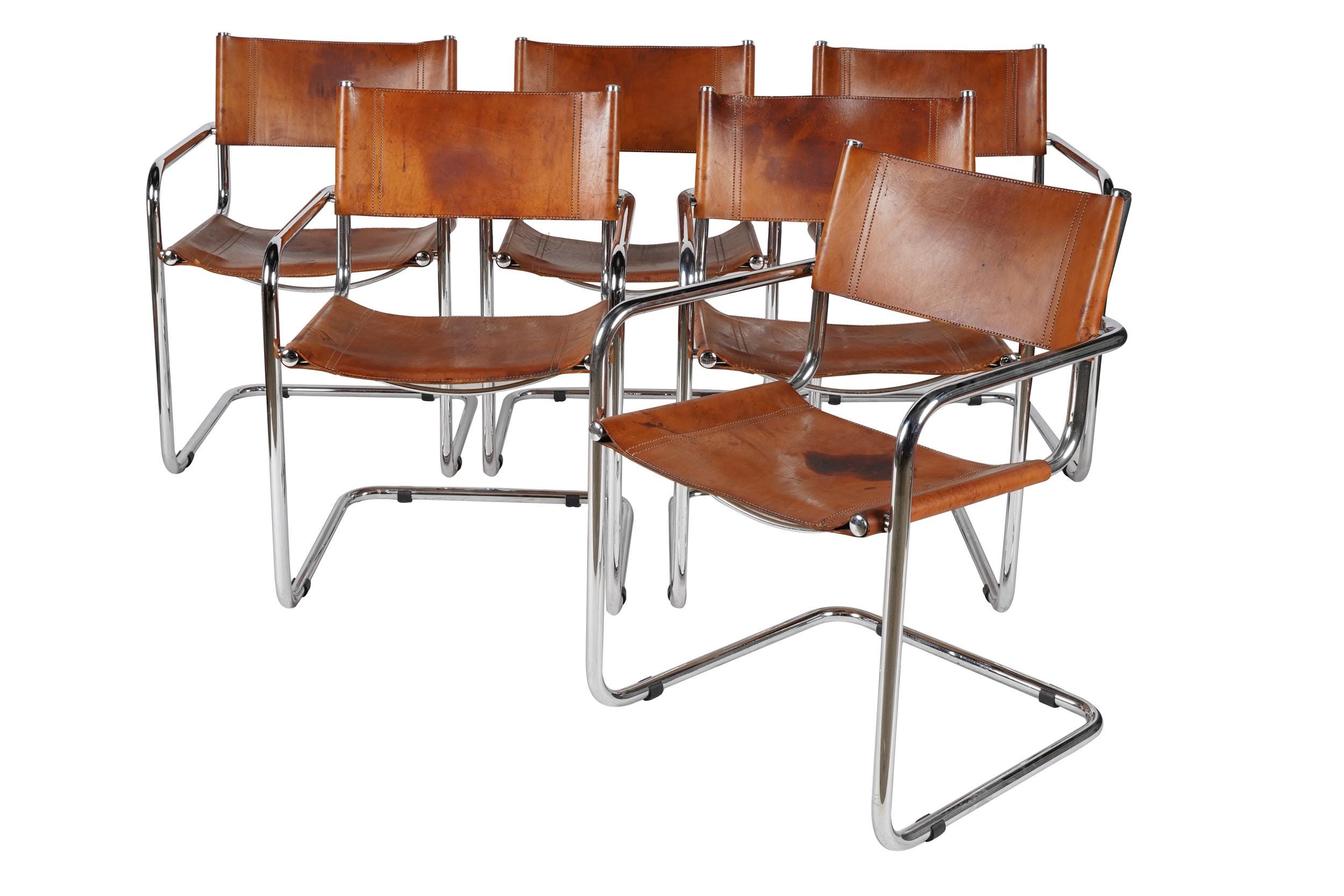 Appraisal: TORD BJORKLUND CHROME LEATHER ARMCHAIRS unsigned Condition with stains and