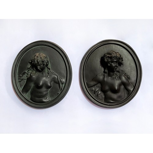 Appraisal: Pair of cast plaster oval nudes signed Clodion Mus e