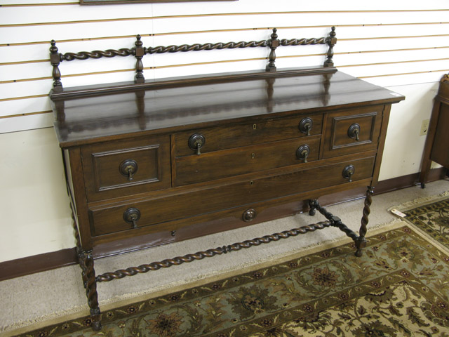 Appraisal: MAHOGANY BUFFET American c 's having a spiral-turned crest rail