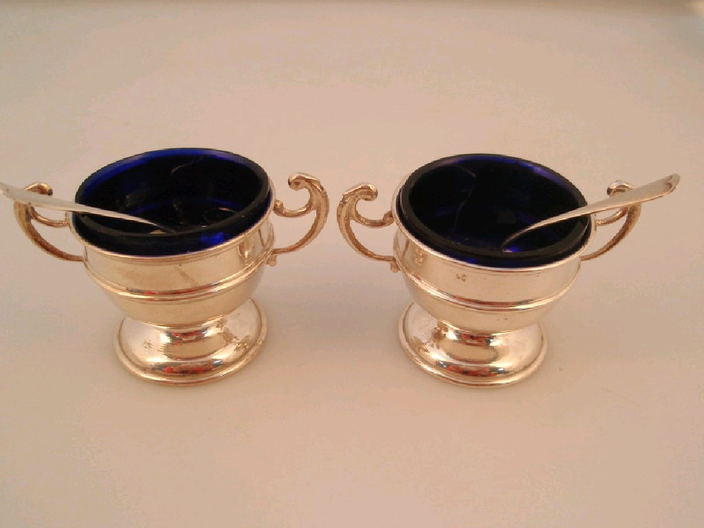 Appraisal: Pair of George V silver salts with blue glass liners