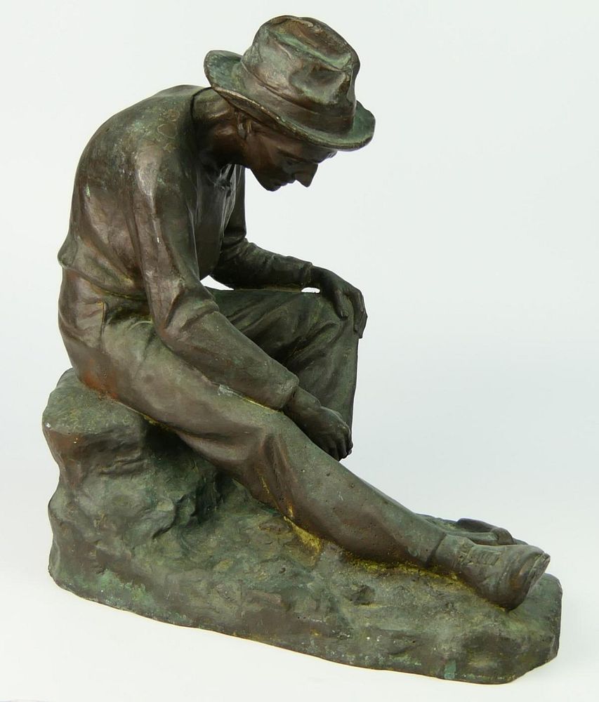 Appraisal: LARGE BRONZE SCULPTURE OF SEATED COAL MINER A very vintage