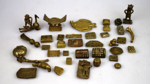 Appraisal: A selection of Ashanti brass gold-weights and other miniature objects