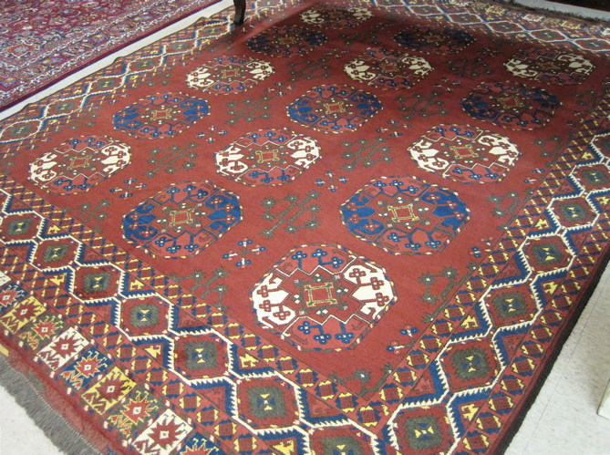 Appraisal: AFGHANI ERSARI CARPET hand knotted in a design comprising three