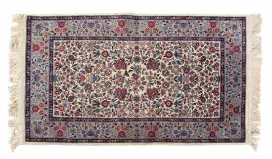 Appraisal: A Savonnerie Wool Mat having a floral center medallion on