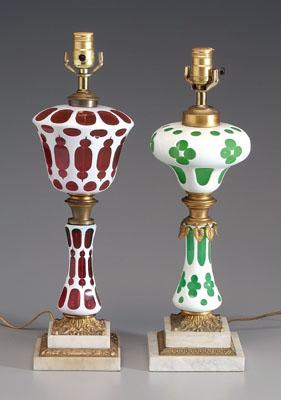 Appraisal: Two ormolu-mounted lamps cased glass white cut to ruby in