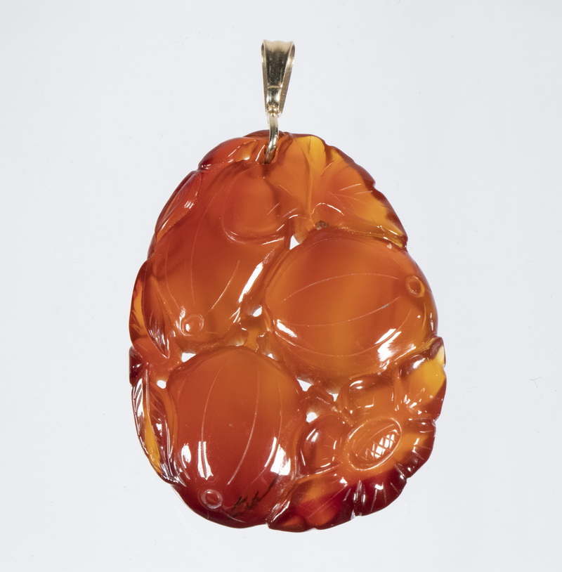 Appraisal: CARVED CARNELIAN PENDANT Chinese carved carnelian fruit form pendant with