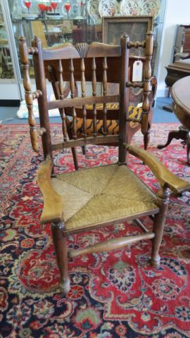 Appraisal: th Century Arm Chair spindle wing design rush seat