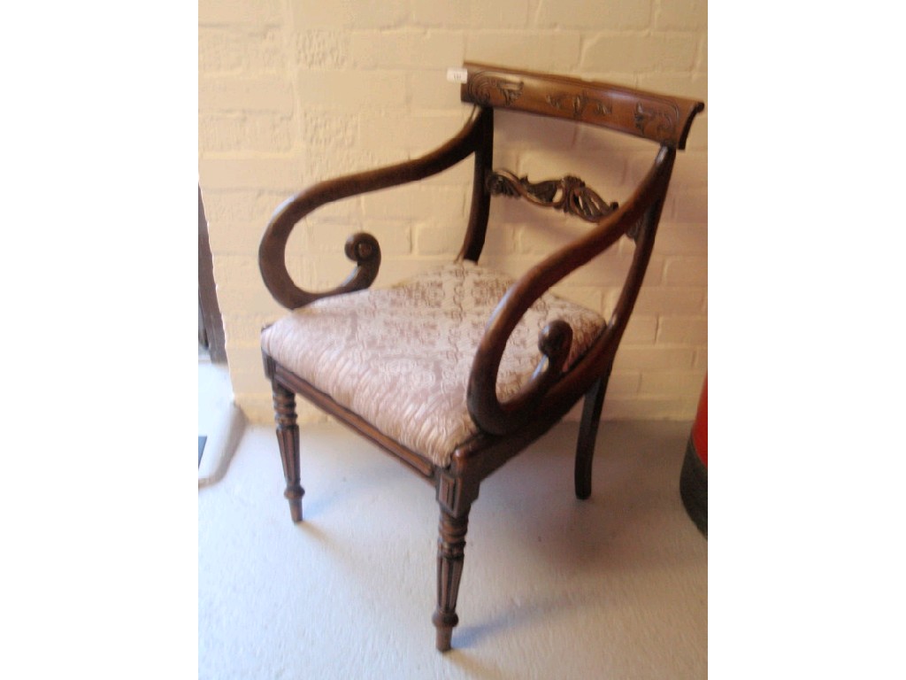 Appraisal: A Regency mahogany dining chair with open scroll arms carved