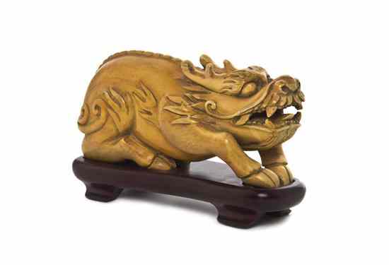 Appraisal: A Chinese Ivory Model of a Beast the horned animal