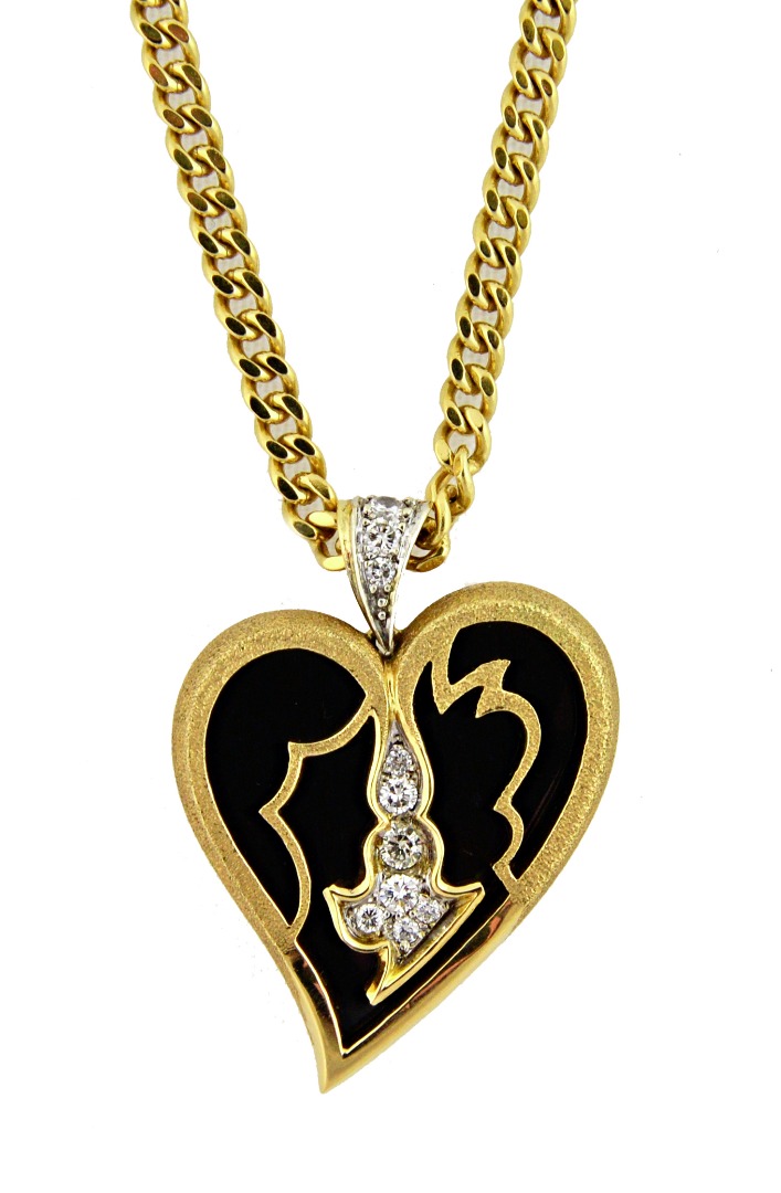 Appraisal: A s ct yellow gold onyx and diamond heart shaped