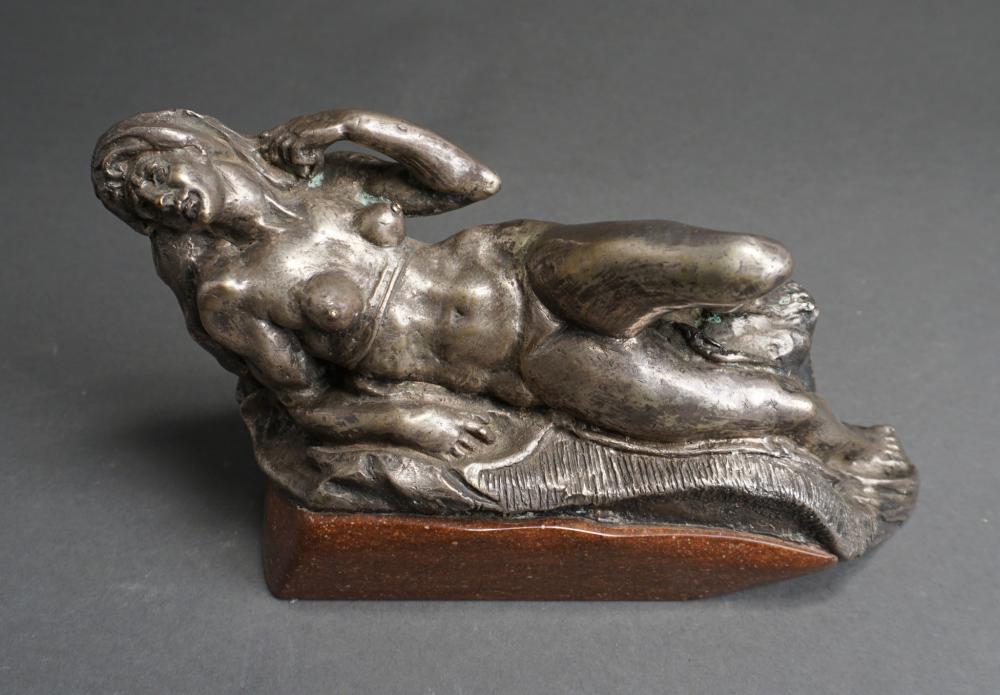 Appraisal: Polished Metal Figure of Reclining Woman on Stone Base H