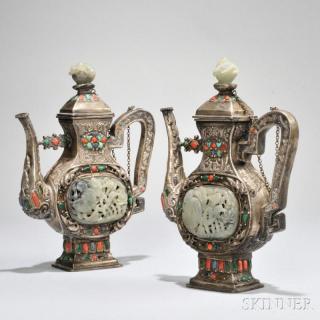 Appraisal: Pair of Mongolian-style Silver Ewers China th th century flattened