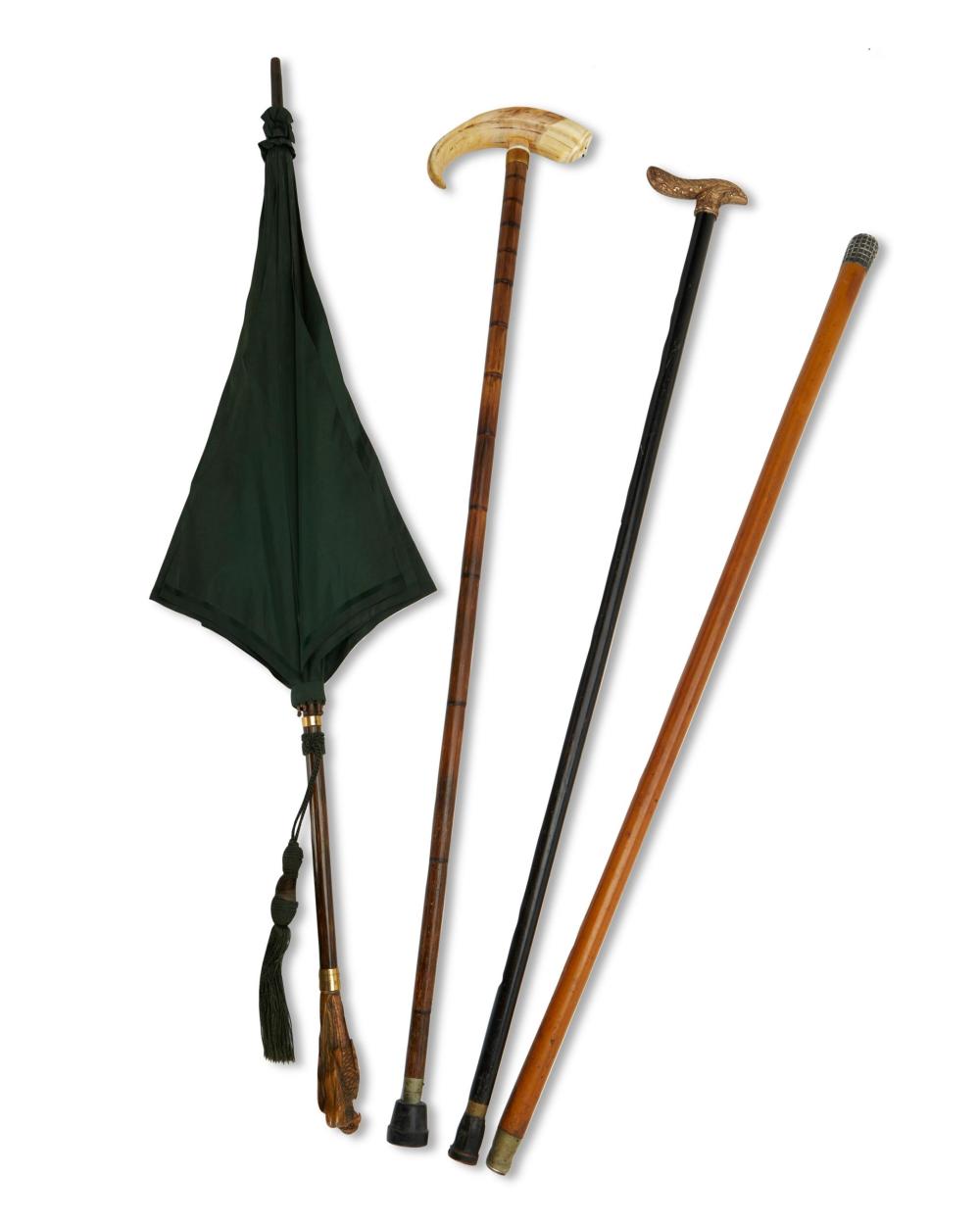 Appraisal: A group of canes and one umbrella Late th early