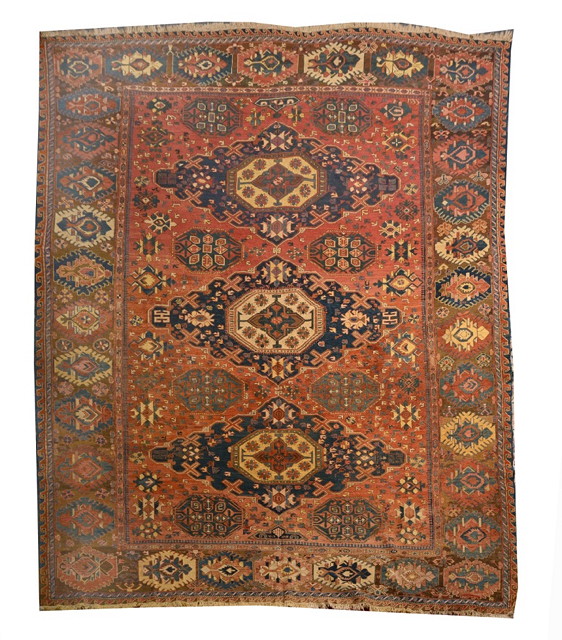 Appraisal: AN ANTIQUE CAUCASIAN SOUMAK MAIN CARPET decorated three central medallions