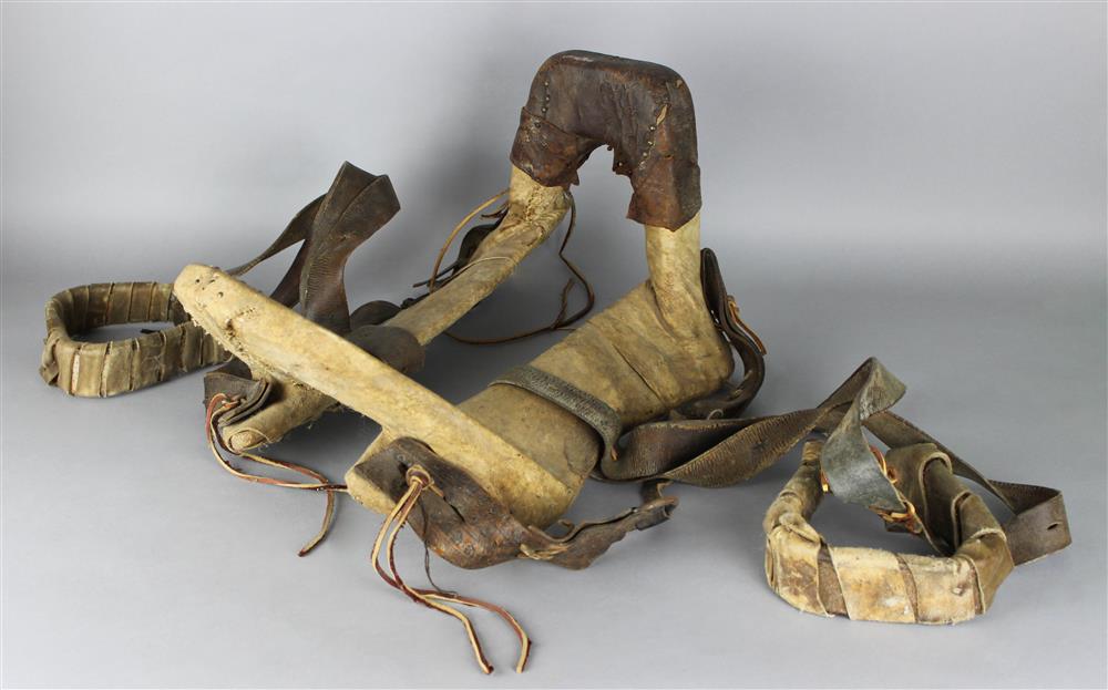 Appraisal: NATIVE AMERICAN RAWHIDE WRAPPED FRAME SADDLE with commercial leather and