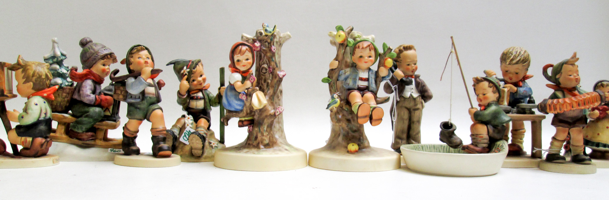 Appraisal: HUMMEL PORCELAIN FIGURINES AND RELATED ITEMS seventeen pieces trademarks from