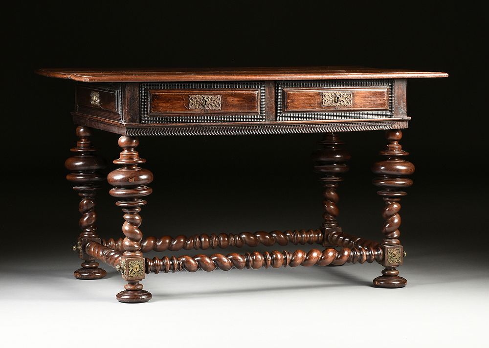 Appraisal: A JACOBEAN STYLE BARLEY TWIST CARVED WALNUT LIBRARY TABLE TH