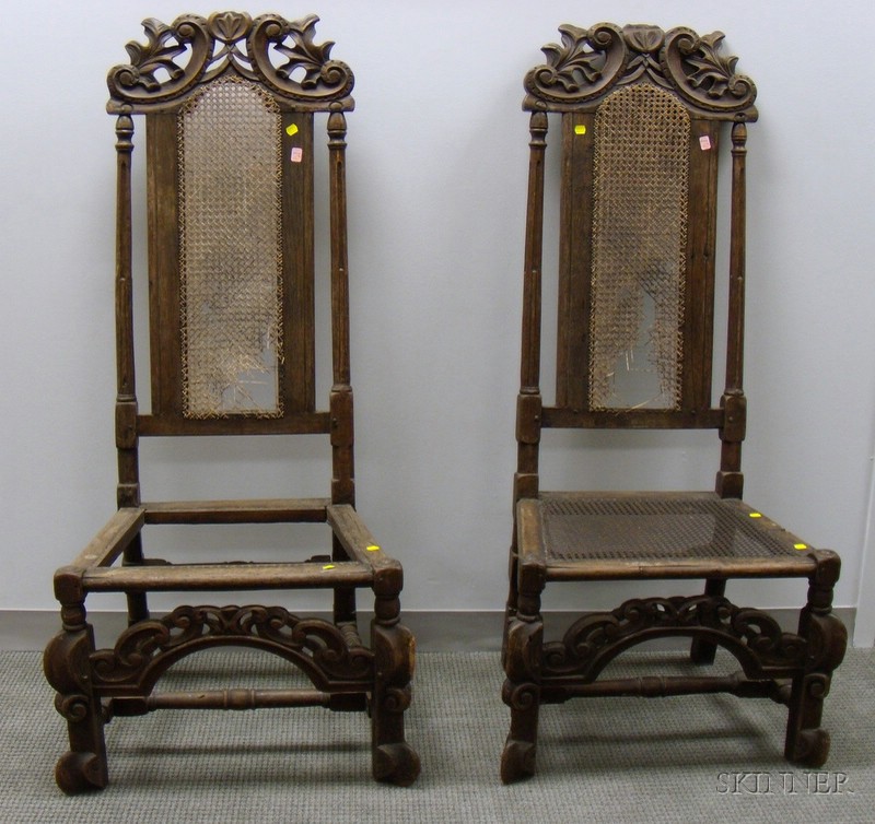 Appraisal: Pair of Jacobean-style Carved Oak and Caned Hall Chairs