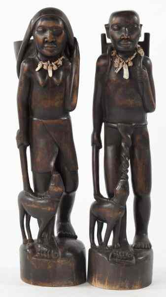 Appraisal: Carved African Male and Female Wood Figures th century the