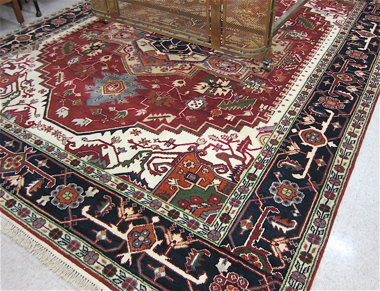 Appraisal: HAND KNOTTED ORIENTAL CARPET Indo-Persian Serapi central geometric medallion and