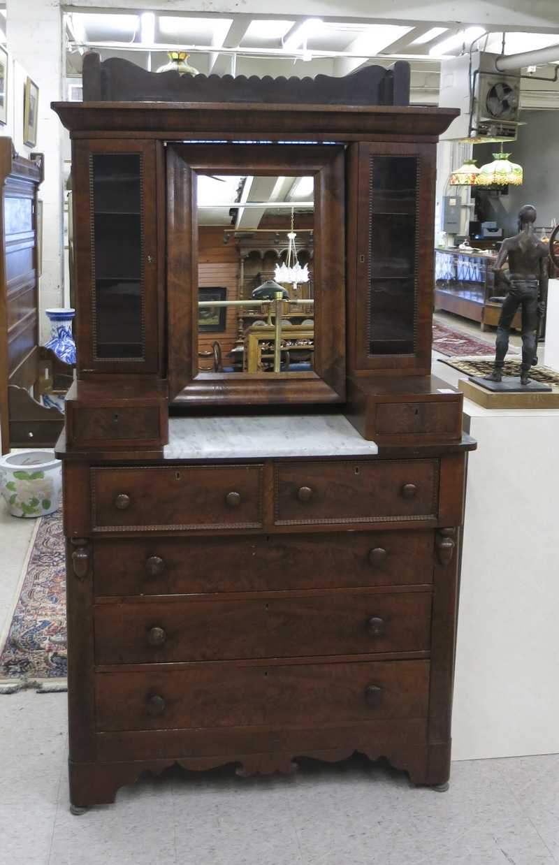 Appraisal: AN UNUSUAL EMPIRE VICTORIAN TRANSITIONAL MAHOGANY DRESSER American mid- th