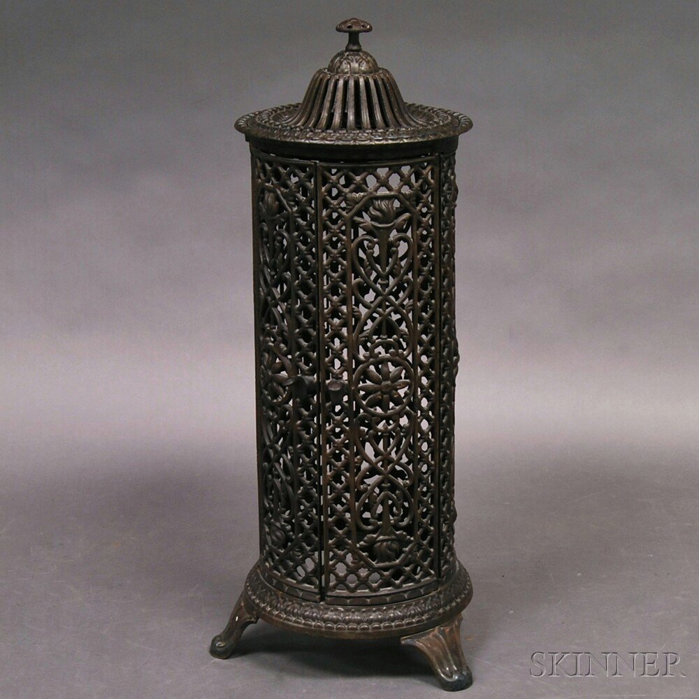 Appraisal: Cast Iron Heater the pierced lid and body with foliate