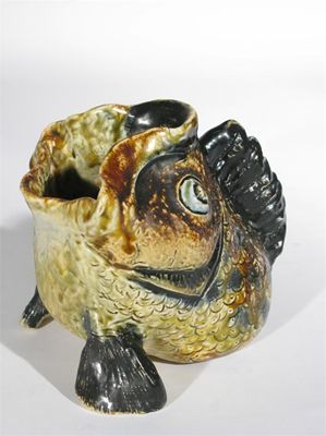 Appraisal: A rare Martin Brothers stoneware grotesque spoon warmer by Robert