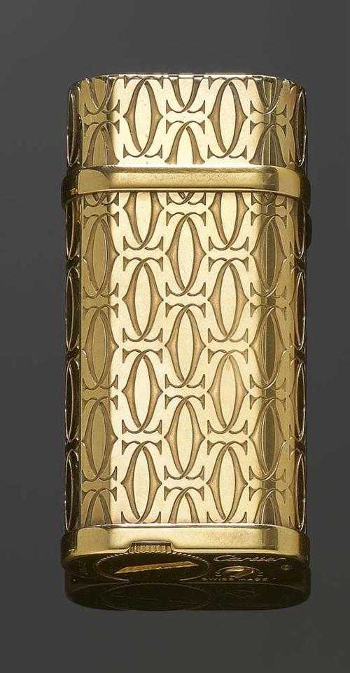 Appraisal: LIGHTER CARTIER Gold-plated Gas lighter C -motif pattern engraved on