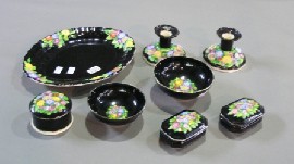 Appraisal: Eight piece porcelain dressing table set with floral motif and