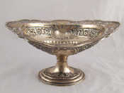 Appraisal: An embossed and pierced footed silver bonbon dish Sheffield x