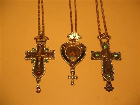 Appraisal: THREE RUSSIAN GILT METAL ENAMEL AND PASTE CRUCIFIXES The first