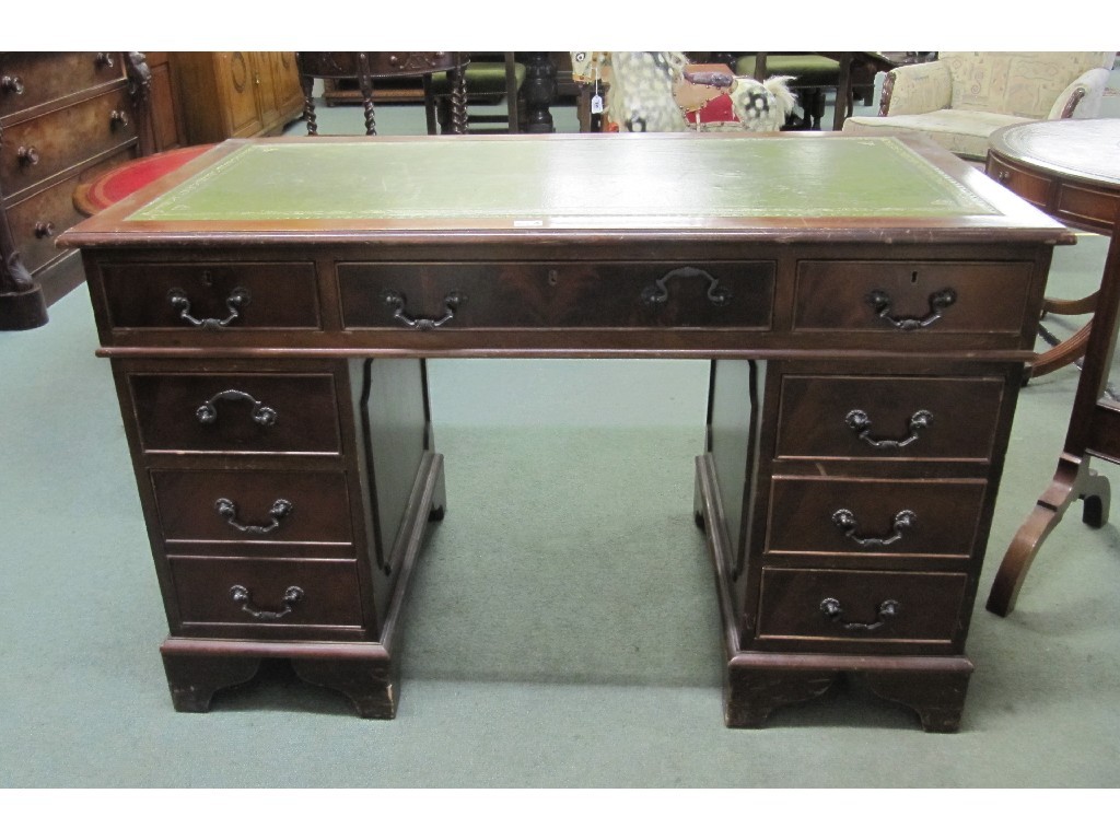 Appraisal: Reproduction mahogany kneehole desk with leather top