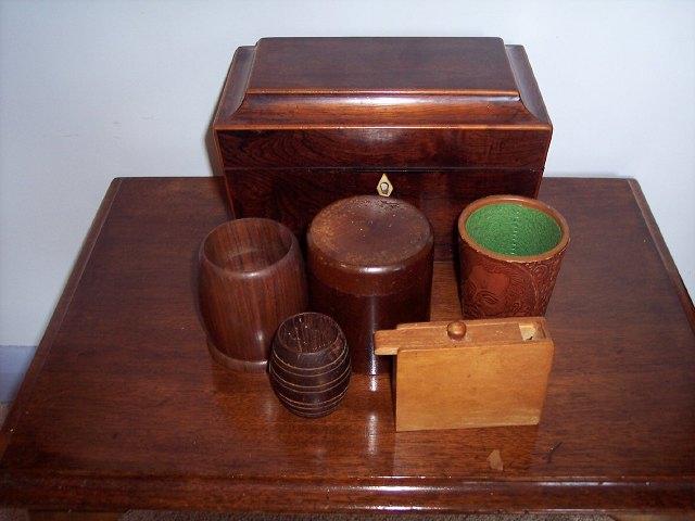 Appraisal: A Regency rosewood sarcophagus shaped tea caddy a turned wood