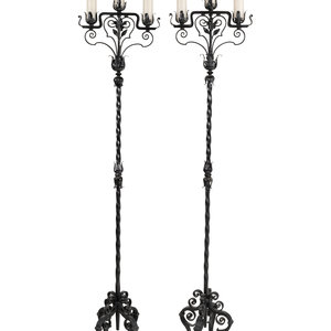 Appraisal: A Pair of Wrought Iron Torch res th Century electrified