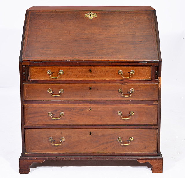 Appraisal: A TH CENTURY MAHOGANY BUREAU the interior fitted pigeon holes