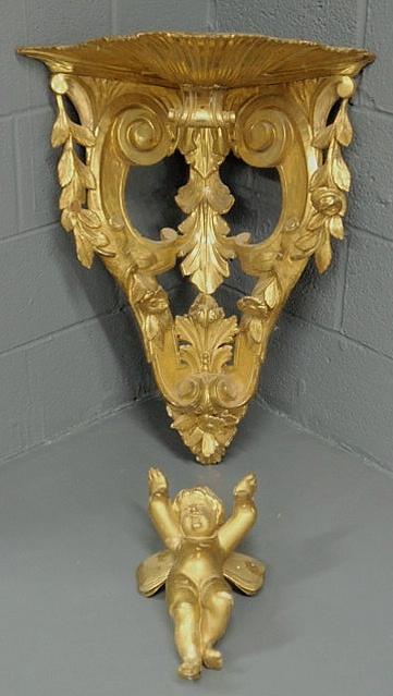 Appraisal: Baroque gilt decorated carved corner shelf with cherub and shell