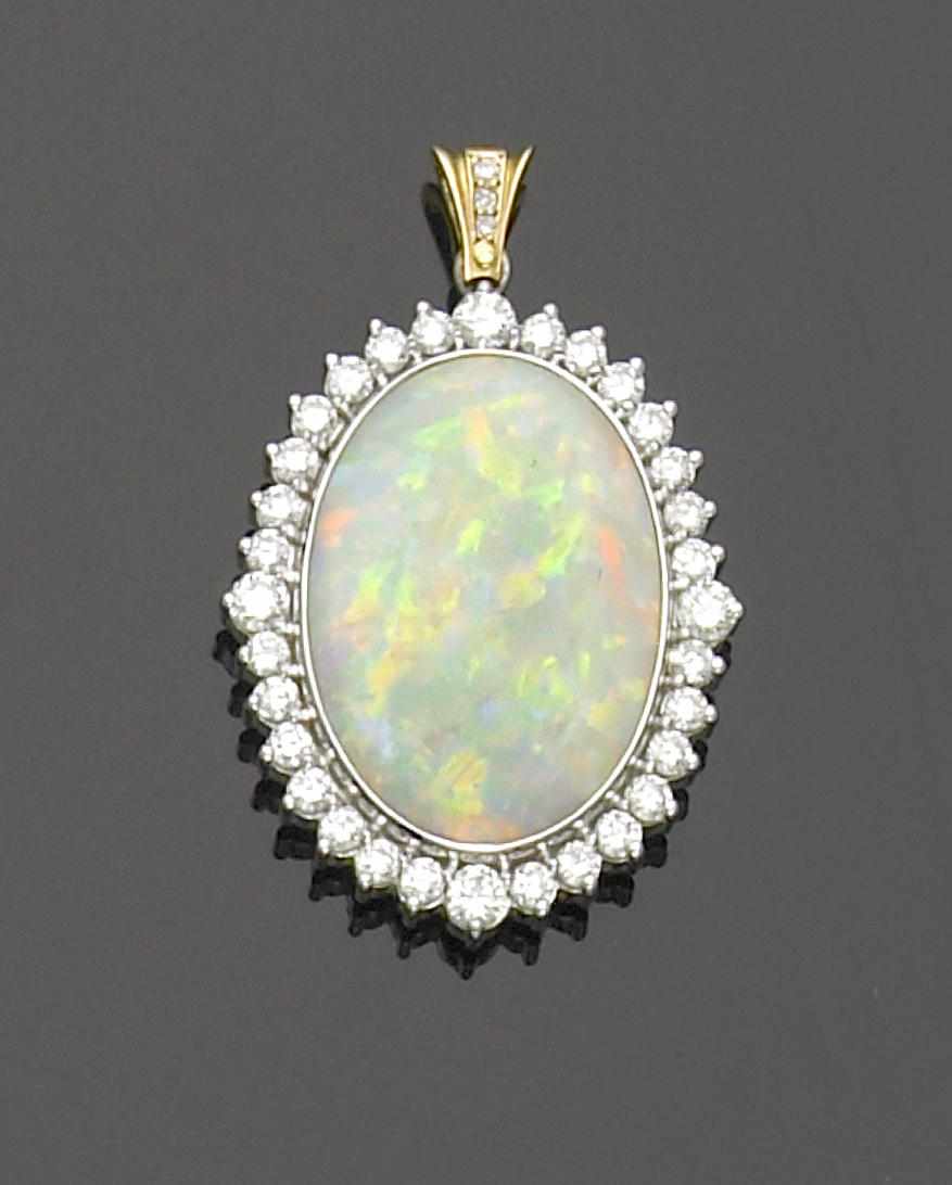 Appraisal: Opal and Diamond Pendant Australia A double-sided oval cabochon crystal