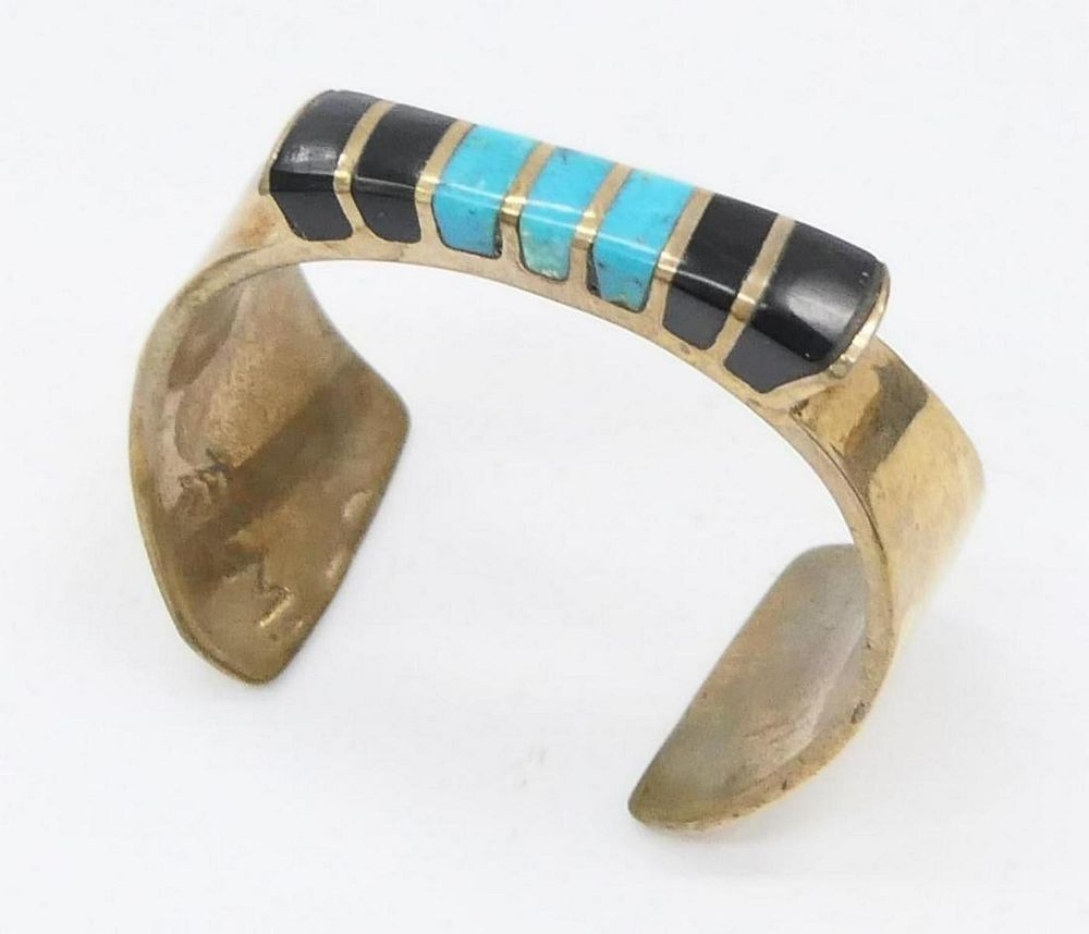 Appraisal: NAVAJO STERLING TURQUOISE ONYX BANGLE Heavy sterling bracelet with onyx