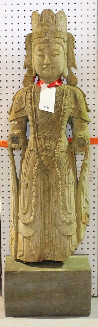 Appraisal: A carved stone figure of a robed goddess in standing