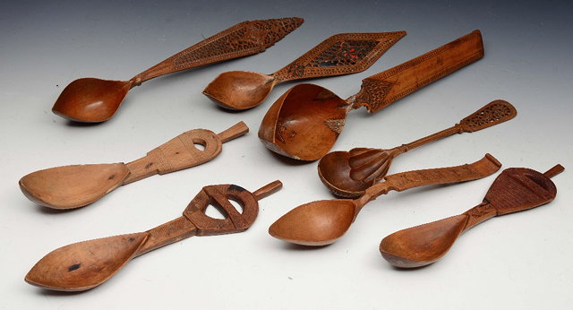 Appraisal: A COLLECTION OF EIGHT PERSIAN PEAR WOOD SHERBERT SPOONS of