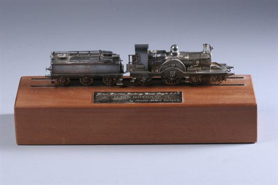 Appraisal: ELIZABETH II SILVER LOCOMOTIVE THE FLYING DUTCHMAN WITH PASSENGER CAR