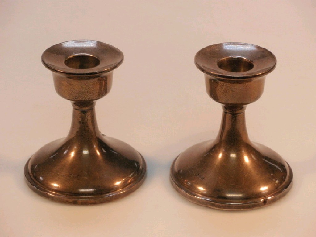 Appraisal: A pair of silver boudoir candlesticks Chester cm high weighted