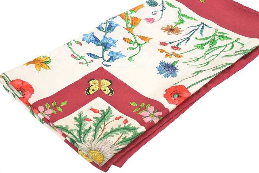 Appraisal: A SILK SCARF BY GUCCI Styled with a multi-coloured floral