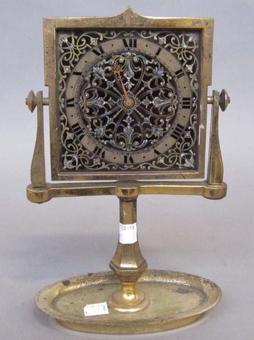 Appraisal: ANTIQUE SWISS DESK CLOCK Enamel face clock is on a