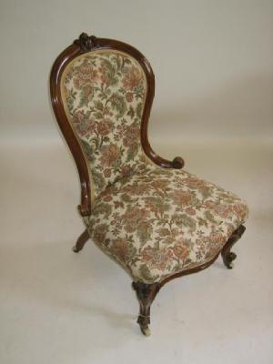 Appraisal: A VICTORIAN WALNUT FRAMED SALON CHAIR of spoonback form upholstered