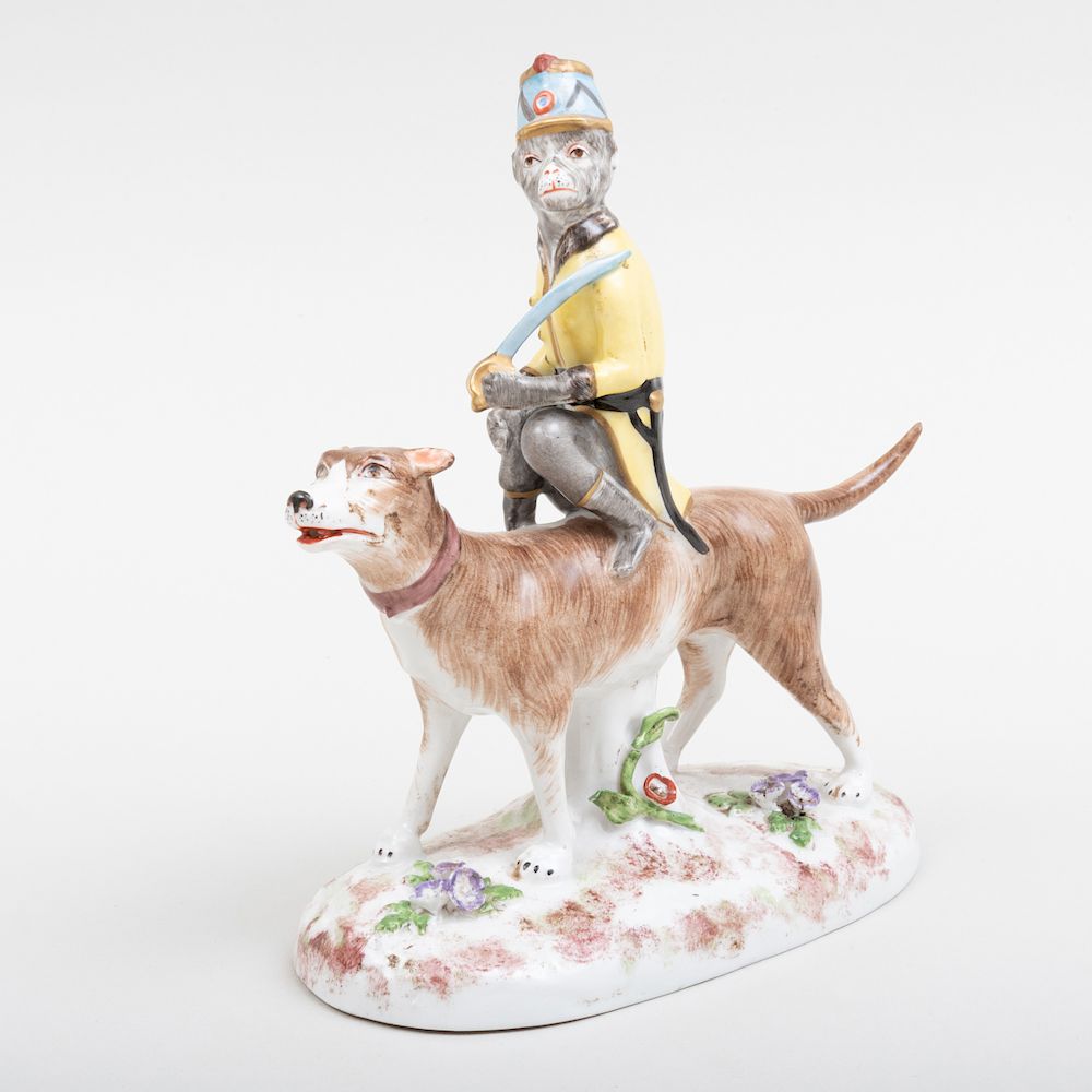 Appraisal: Paris Porcelain Figure of a Monkey Riding a Dog Printed