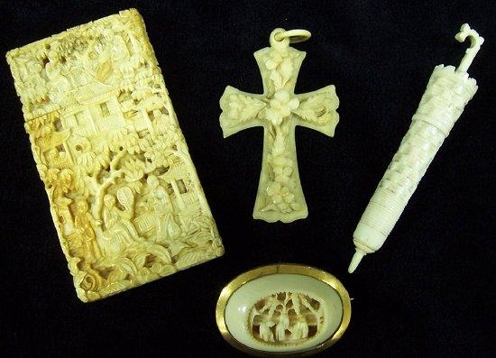 Appraisal: An ivory bodkin case modelled as a parasol cm long